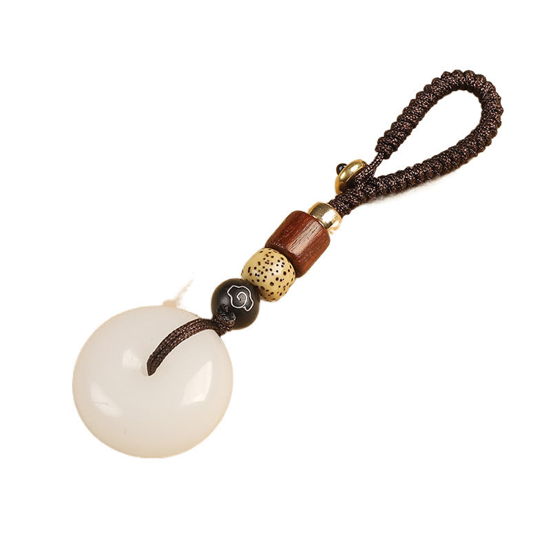 Natural white agate ping an kou peace buckle keychain isolated on white background