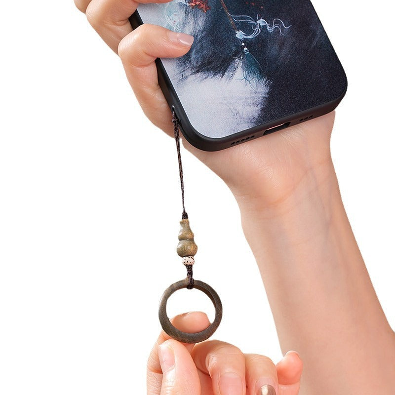 Sandalwood Phone Grip – Closeup of hand using green sandalwood ring lanyard with phone on white background, grip demonstration