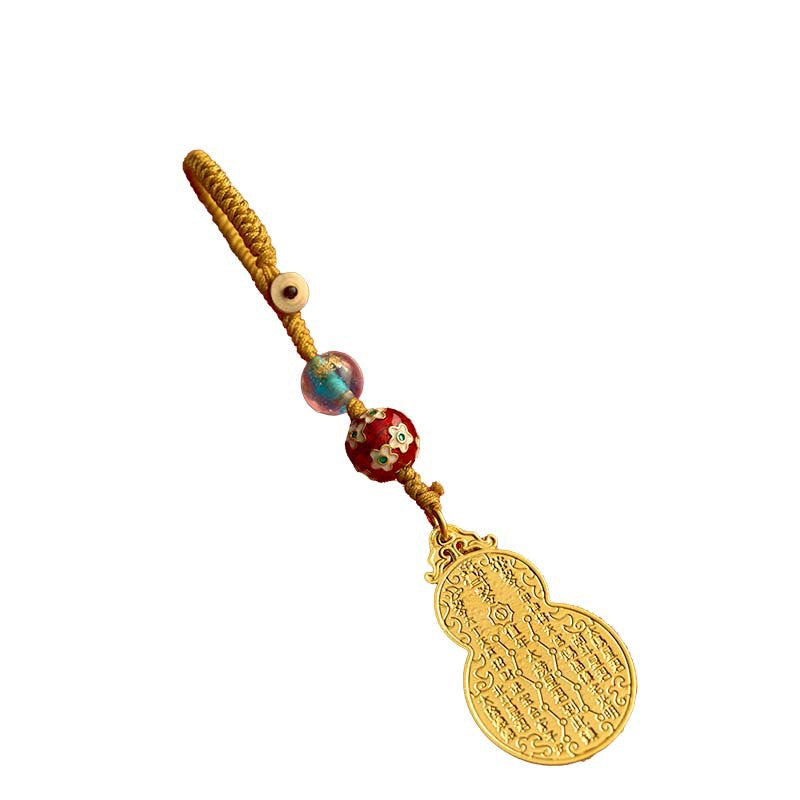 Antique gold gourd keychain with gold cord, white background product shot