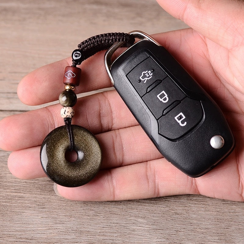 Gold Obsidian Pendant – Gold sheen obsidian keychain attached to car key in hand, everyday protection talisman