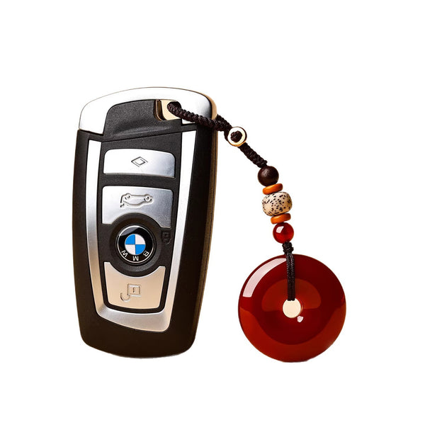 Jade Keychain Pendant – Red-brown jade donut on BMW key fob white background with brown cord, good luck car gift