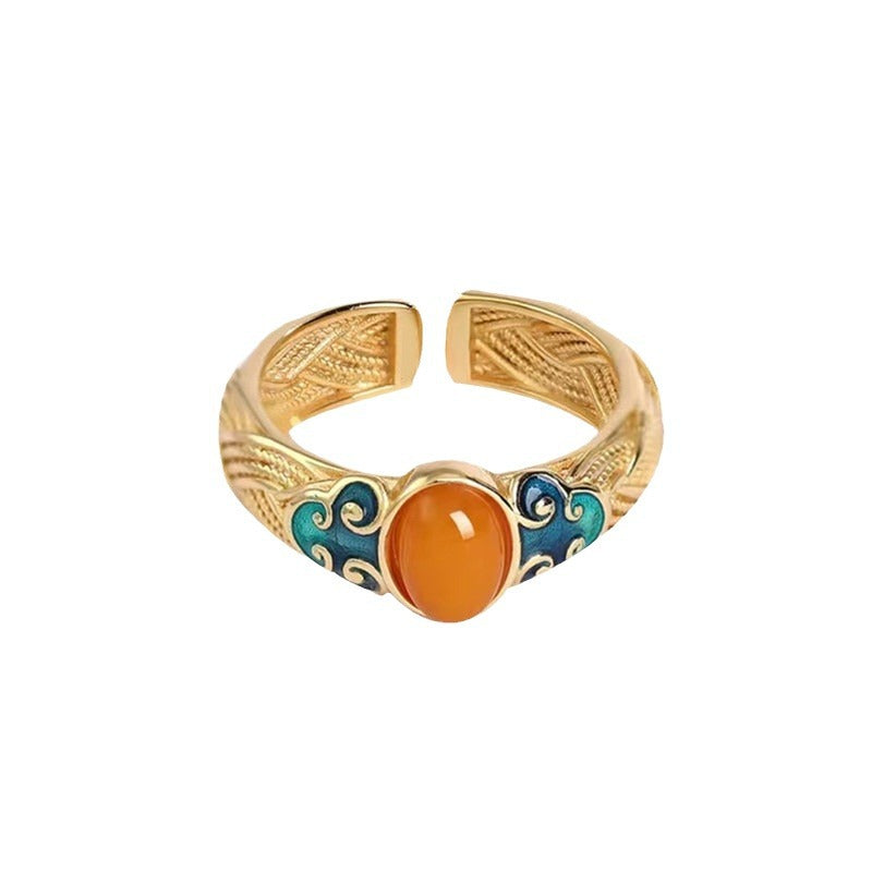 Amber Enamel Ring – angled front view on white background with turquoise enamel accents