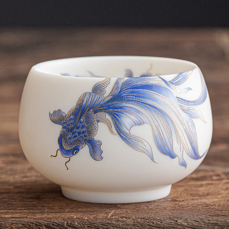 Koi Fish White Ceramic Cup - warm lighting highlighting porcelain translucency, premium