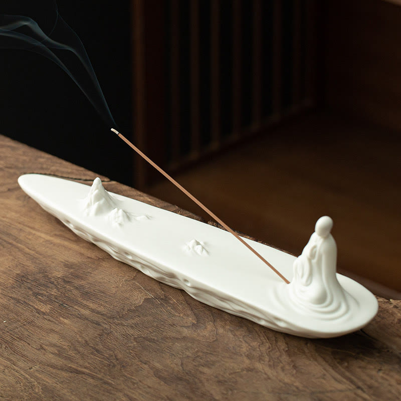 Buddha Monk Sea Wave Mountain Ceramic Incense Burner – White monk on mountain peaks with lit incense and smoke trail, ceramic meditation decor