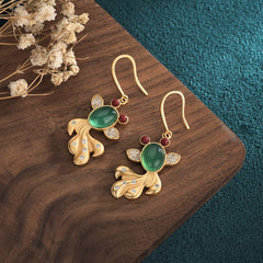 Jade Koi Fish Earrings - close-up of delicate fin and scale carving detail, luck charm