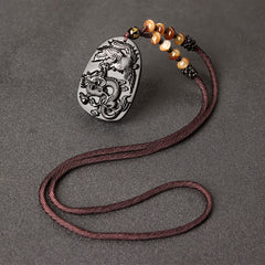 Black Obsidian Tiger Eye Dragon Phoenix Necklace – oval obsidian dragon-phoenix pendant with amber strand, harmonious