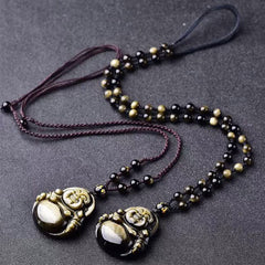 Gold Sheen Obsidian Laughing Buddha Pendant – two full necklaces flatlay on gray with beaded cords, set