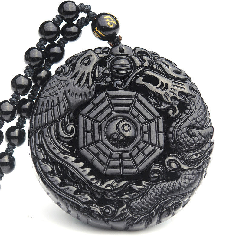 Bagua Dragon Phoenix Obsidian Pendant – Carved relief dragon and phoenix on white background, protective