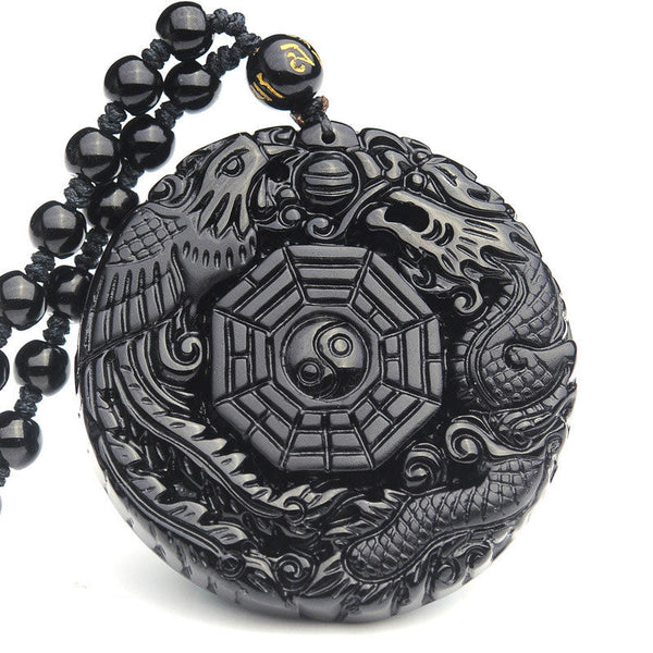 Bagua Dragon Phoenix Obsidian Pendant – Carved relief dragon and phoenix on white background, protective
