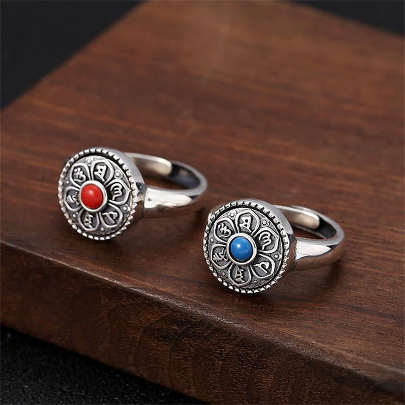 Tibetan Om Mani Padme Hum Ring – Red and blue stone variants on dark wood, Tibetan ring Main image