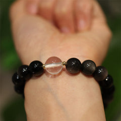 Yin Yang Obsidian Crystal Bracelet - Black beads with clear quartz center on wrist, obsidian bracelet