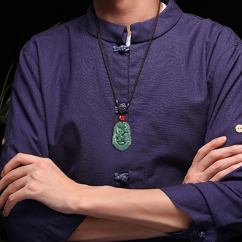 Jade Zodiac Prosperity Necklace – Worn on model in indigo shirt, lifestyle scale, wearable