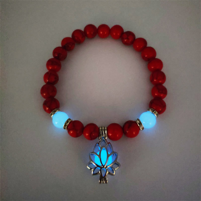 Tibetan Turquoise Glowstone Lotus Bracelet – red cinnabar beads with cyan glowing lotus pendant flat lay, red glowstone bracelet