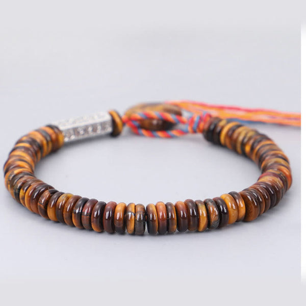 Tiger Eye Om Mani Padme Hum Bracelet - angled view showing metal clasp and cord tassel