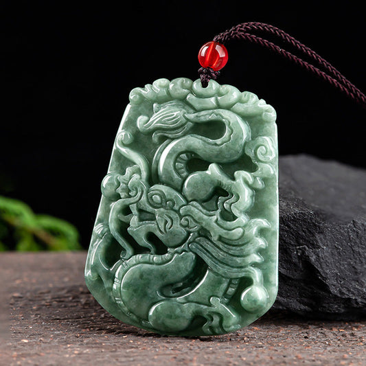 Chinese Zodiac Dragon Jade Strength Necklace - angled view of rectangular jade dragon pendant with deep relief, strength