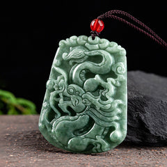 Chinese Zodiac Dragon Jade Strength Necklace - angled view of rectangular jade dragon pendant with deep relief, strength