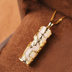Jade Dragon Phoenix Copper Pendant – Gold phoenix bird on white jade cylinder with snake chain, graceful