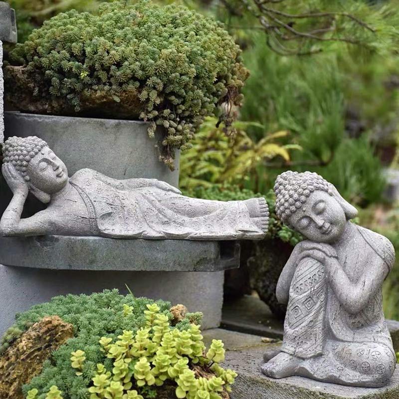 Tibetan Meditation Buddha Resin Decoration – pair of Buddha statues in tranquil garden scene with succulents and stone pedestal, meditation set