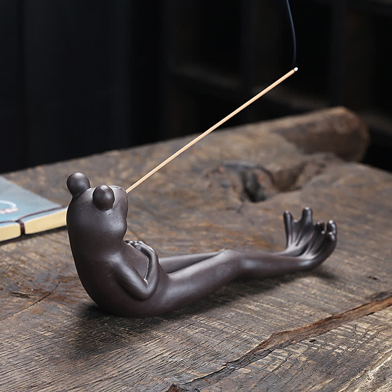Meditation Frog Ceramic Incense Burner - Frog lounging with webbed feet on aged wood plank, ceramic frog decor
