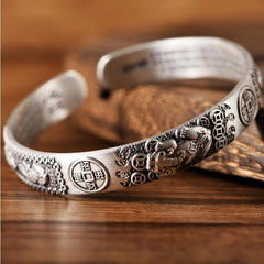 Tibetan PiXiu Heart Sutra Coin White Copper Wealth Bracelet – detailed PiXiu carving on wood surface, Buddhist talisman