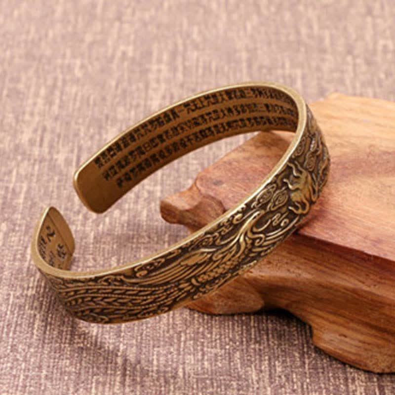 Om Mani Padme Hum Dragon Phoenix Bracelet - Brass cuff with phoenix engraving and sutra text on wood stand, Heritage