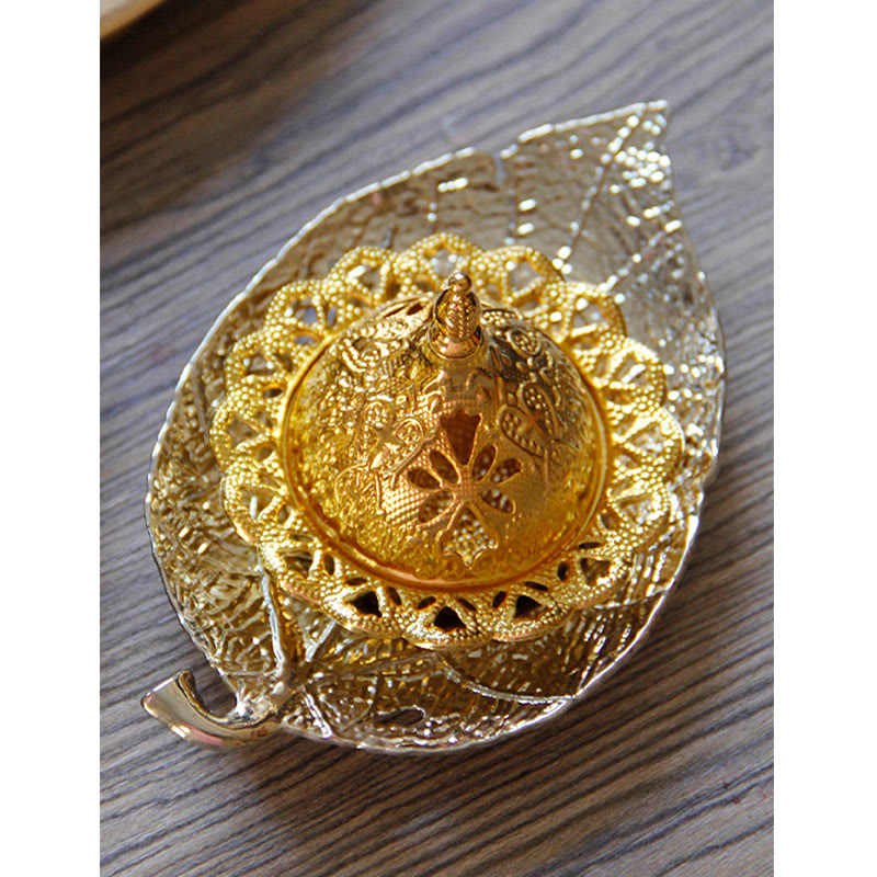 Tibetan Gold Leaf Coaster Incense Burner – Close-up gold filigree dome on wood grain surface, ornate brass incense burner