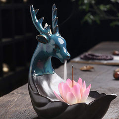 Little Deer Ceramic Lotus Incense Burner – Teal ceramic deer head with smoke waterfall on wooden table, zen atmosphere
