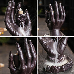 Ceramic Ghost Hand Skull Incense Burner – Four-angle view of skull hand design with active smoke cascade, dark stone setting