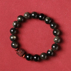 Gold Sheen & Rainbow Obsidian Fu Bracelet – obsidian beads on terracotta surface, healing stone jewelry