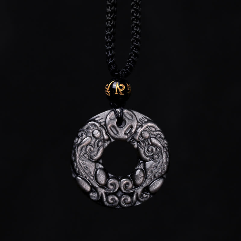Silver Sheen Obsidian Double PiXiu Necklace – Silver sheen obsidian disc with black cord on black background, pendant