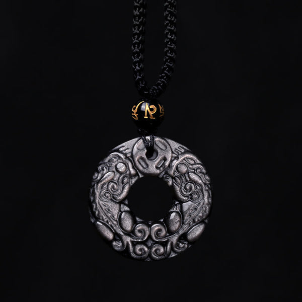 Silver Sheen Obsidian Double PiXiu Necklace – Silver sheen obsidian disc with black cord on black background, pendant
