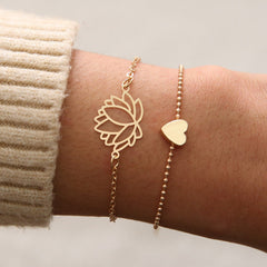 Lotus Heart Enlightenment Bracelet - Worn on wrist with knit sleeve, gold lotus and heart chain set, healing bracelet