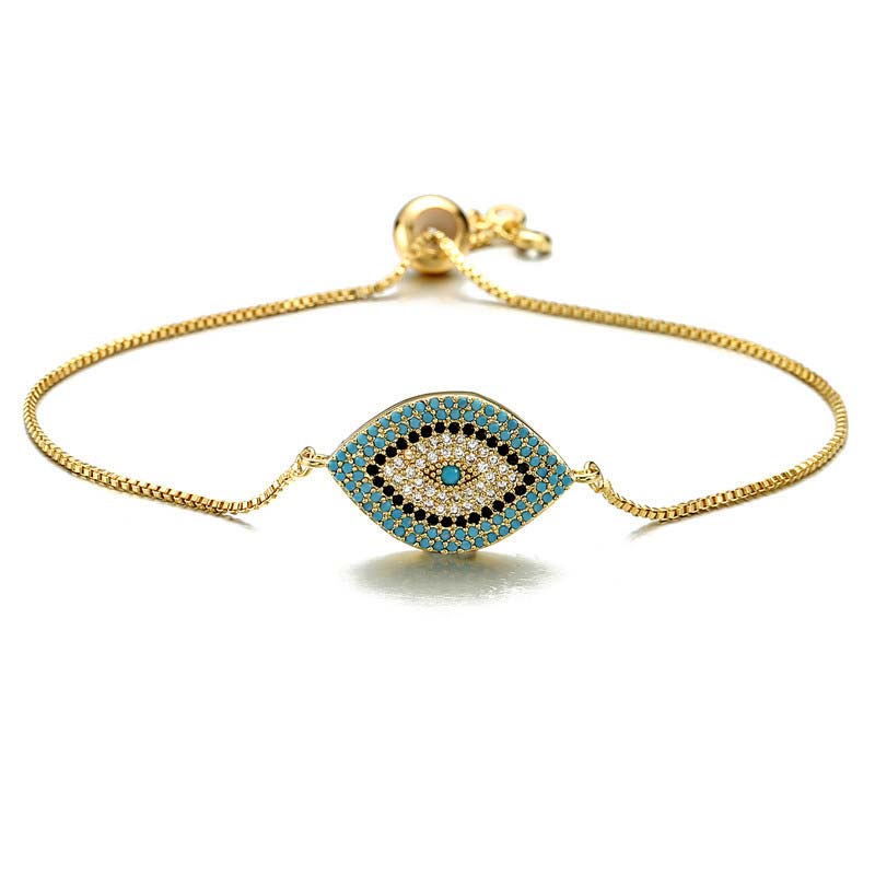 Evil Eye Healing Bracelet – Gold tone chain bracelet with turquoise evil eye pendant on white background