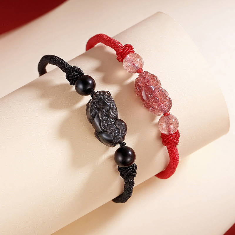 Silver Sheen Obsidian Bracelet – Couple bracelets on white stand with PiXiu charms