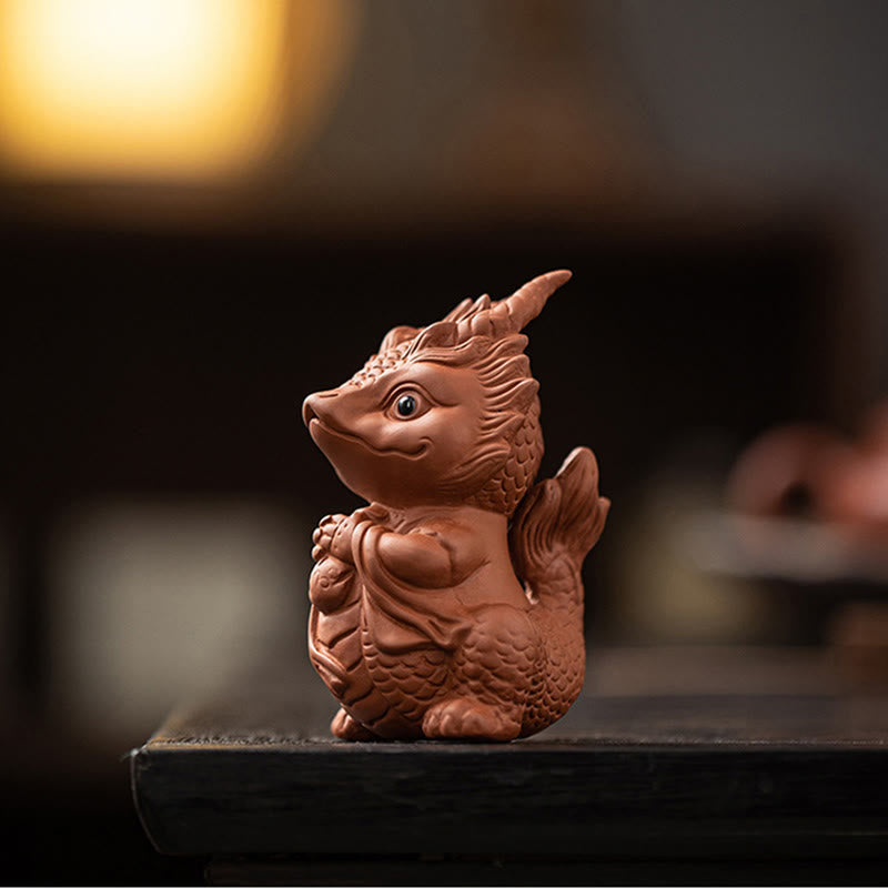Luck Dragon Purple Clay Tea Pet - tea poured over dragon with brush care, ritual