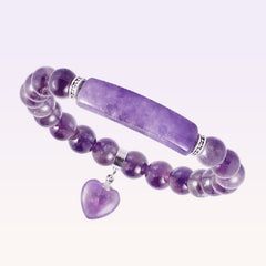 Natural Multi-Stone Love Heart Healing Bracelet - Purple amethyst beads with curved bar centerpiece, silver spacers, and heart charm on lavender gradient background