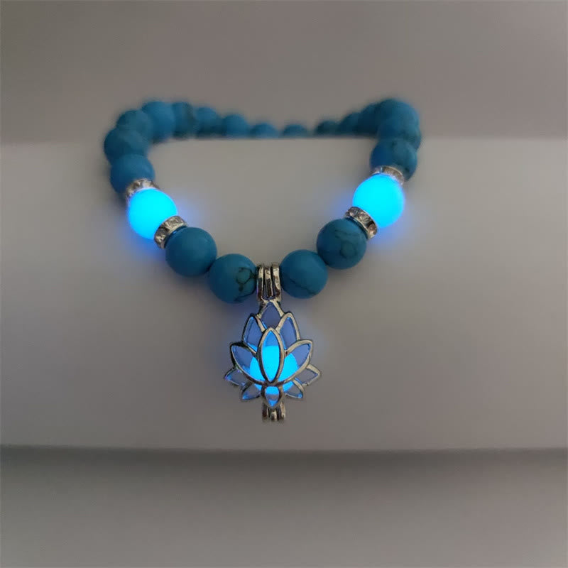 Tibetan Turquoise Glowstone Lotus Bracelet – turquoise beads with cyan glowing lotus and accent beads on light surface, glowstone