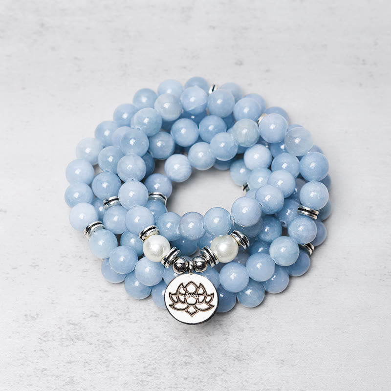108 Mala Aquamarine Bracelet – coiled blue beads with silver lotus charm, peaceful