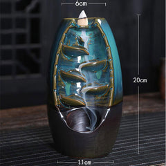 Tibetan Dragon Incense Burner – Teal ceramic backflow with white smoke waterfall on dark mat, Healing