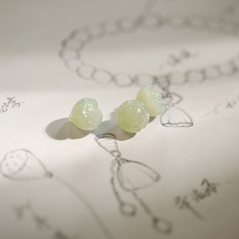 White Agate Jade Lotus Bracelet - Hand-carved celadon lotus pod beads on artisan sketch paper, gemstone pendants