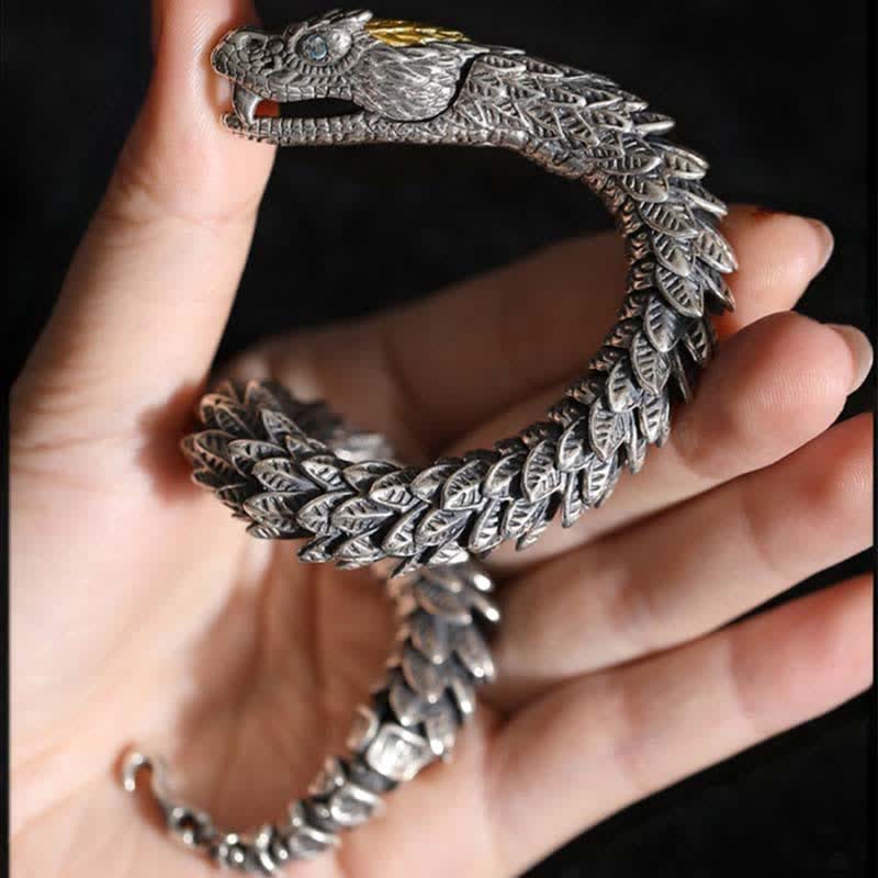 Dragon Snake Copper Bracelet – Open-jaw dragon head with gold accent held on black backdrop, Intimidating