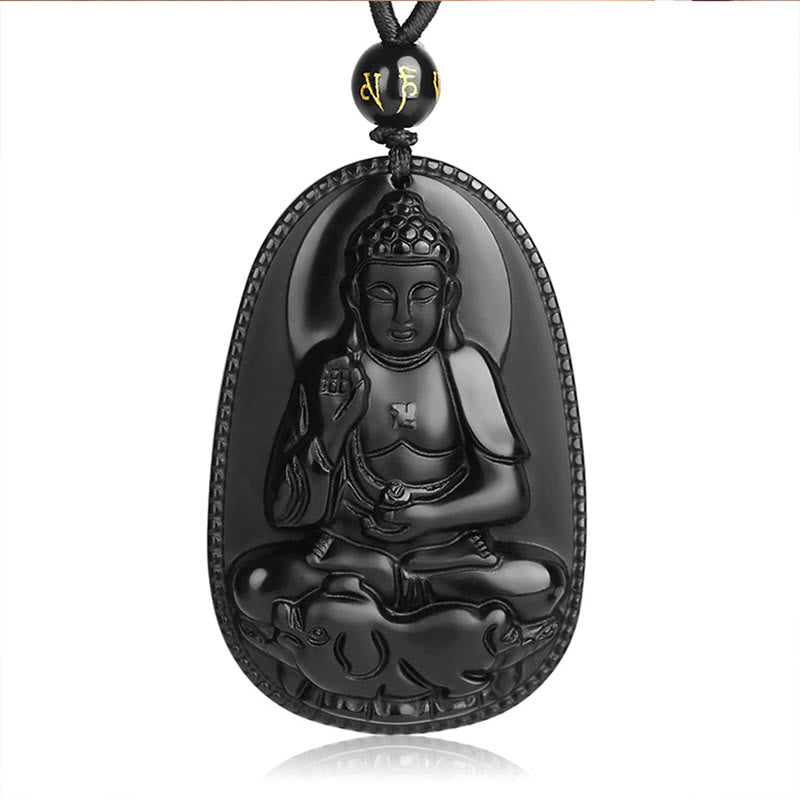 Chinese Zodiac Buddha Black Obsidian Necklace – Thousand-Hand Guanyin obsidian pendant with gold script bead on dark cord, wooden background, compassionate guardian