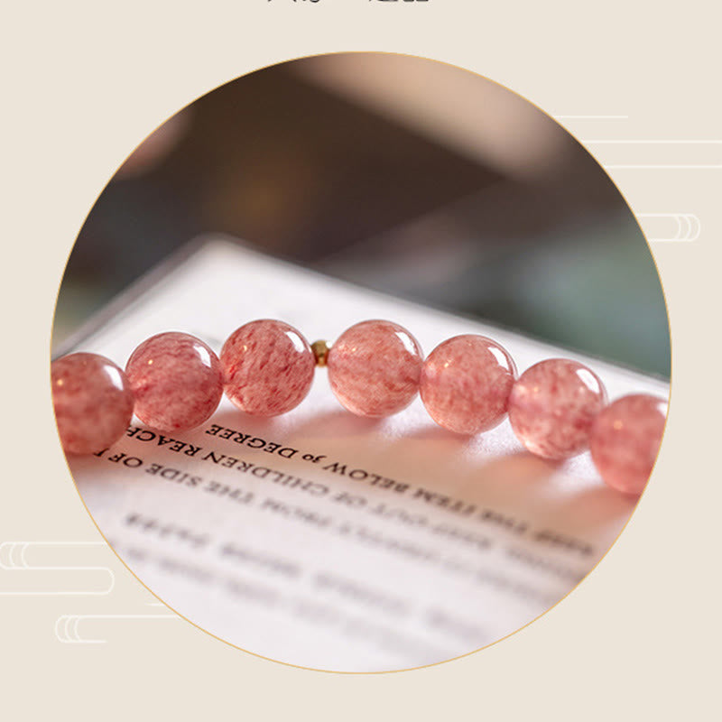 Strawberry Quartz Moonstone Bracelet – close-up pink strawberry quartz beads circular frame, love healing
