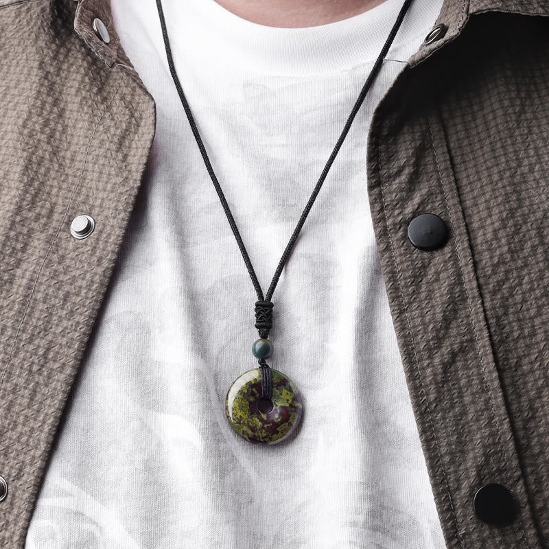 Lucky Coin Pendant Healing Crystal Gemstone Necklace – Deep blue lapis lazuli donut pendant with golden pyrite flecks on black cord