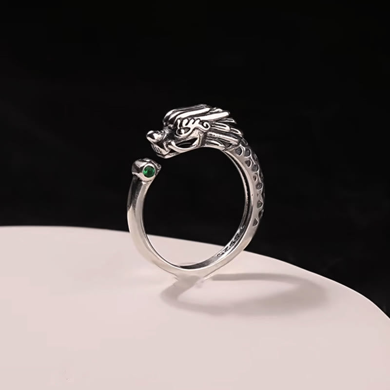 Vintage Dragon Design Ring - Silver dragon head open ring with green gem on white stand, Success