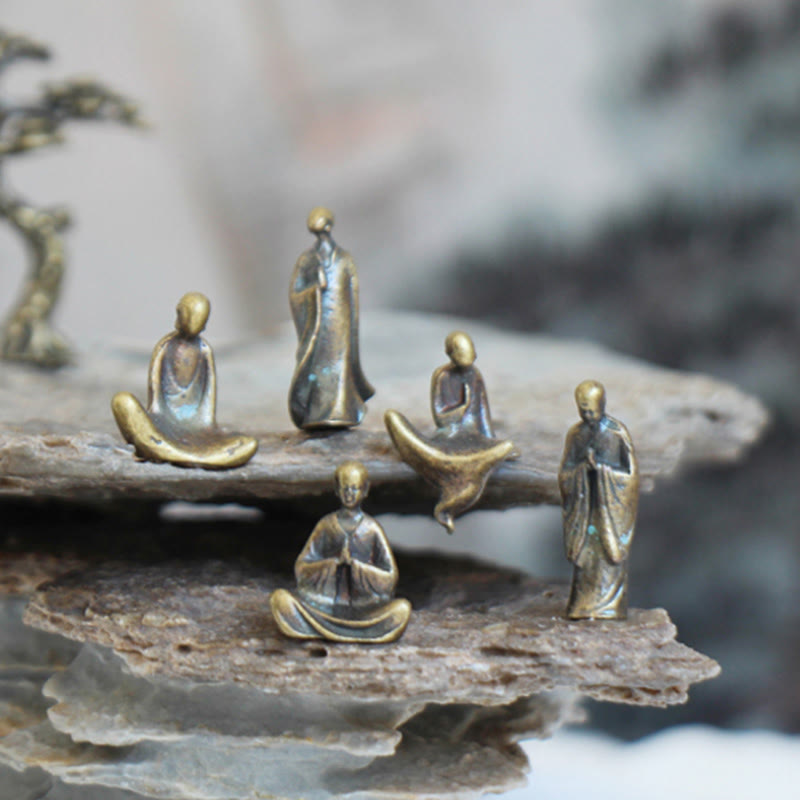 Mini Metal Meditation Buddha Decoration – five monks arranged on two-tier stone display, zen home decor