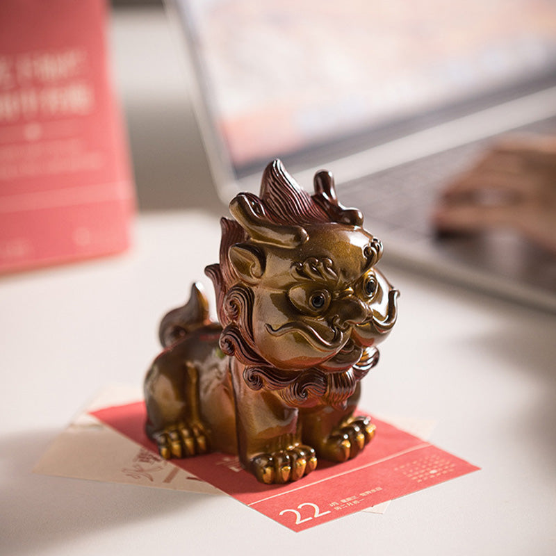 Small PiXiu Tea Pet – Golden PiXiu side view on red card with desk calendar background, decor