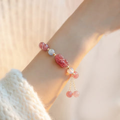Strawberry Quartz Moonstone Bracelet – model wrist soft warm lighting, pink quartz moonstone, love healing