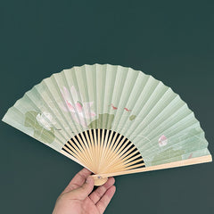 Lotus Koi Fish Folding Fan - hand-held open displaying pink lotus and koi details, graceful