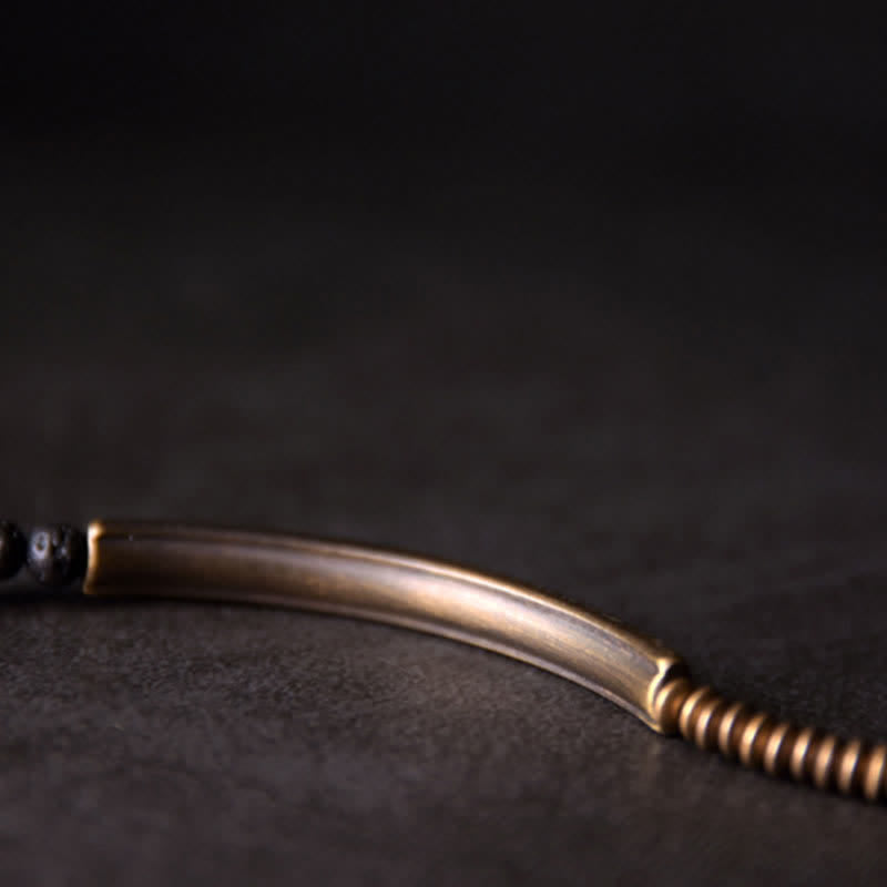 Lava Rock Copper Healing Bracelet – Black lava beads with copper wire-wrapped focal and silver-toned accents on white background, product photography clean shot